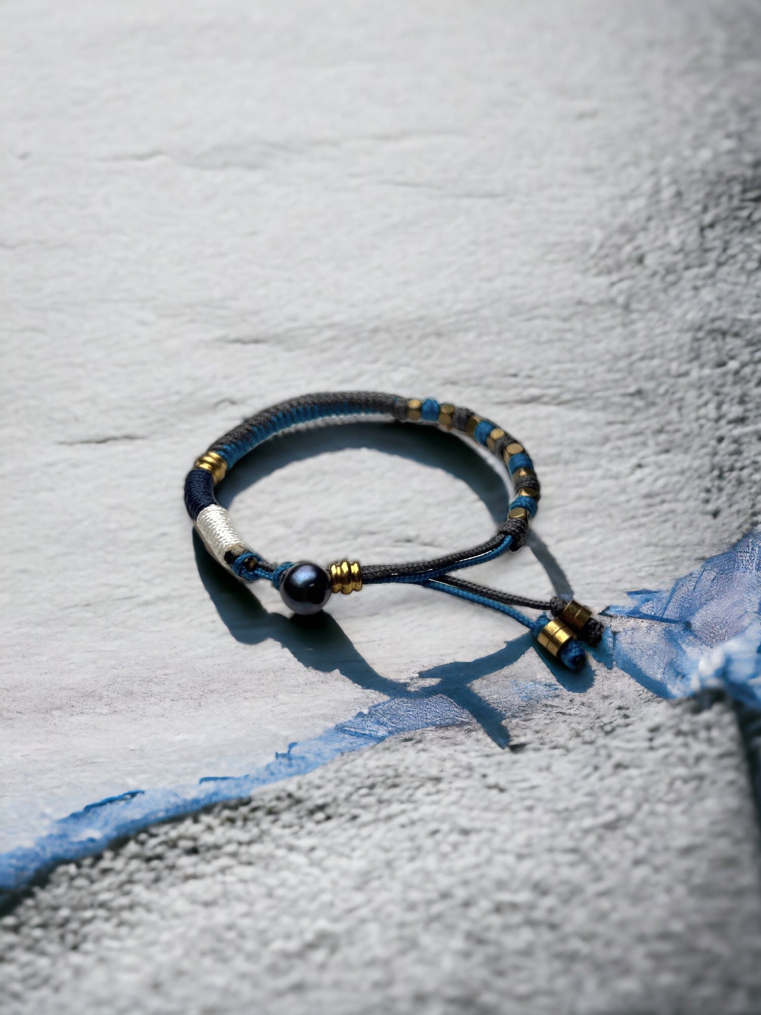 Ocean Whispers Bracelet HaumānaKai showing cord, brass and freshwater pearl details