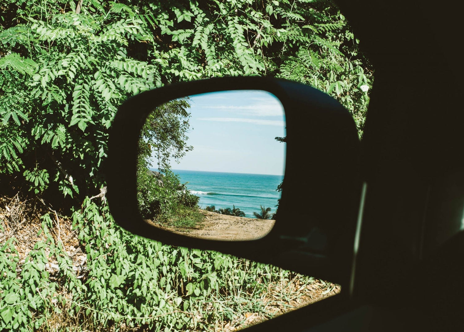 Ocean-inspired surf bracelet worn by surfer
