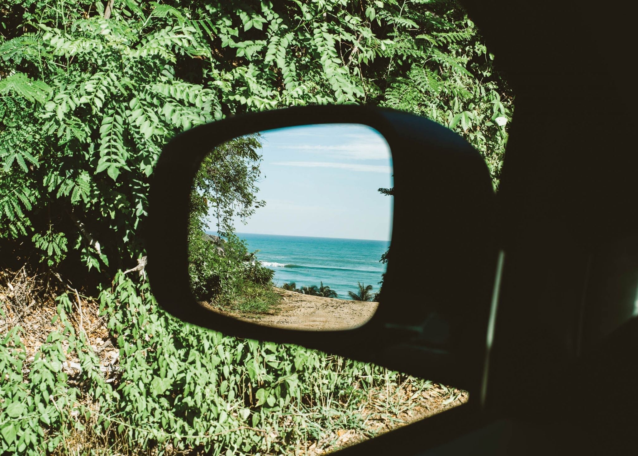 Ocean-inspired surf bracelet worn by surfer